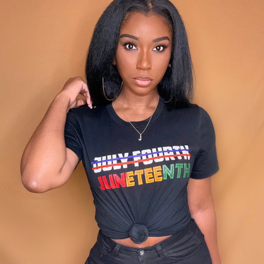 A black cotton t-shirt with a powerful statement that reads, "Juneteenth" This empowering t-shirt celebrates the fight for gender equality, featuring bold typography and a clear message. Perfect for making a statement and sparking conversations, it showcases the importance of equal rights for girls and women in a stylish and impactful way.