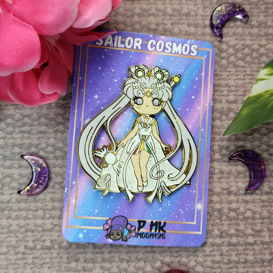 A striking 2-inch gold enamel pin depicting the powerful Sailor Cosmos. This intricately designed pin showcases Sailor Cosmos in all her celestial glory, with exquisite detailing and a shimmering gold finish. The pin captures the essence of strength and elegance, making it a must-have accessory for fans of Sailor Moon and collectors alike. Add a touch of cosmic beauty to your ensemble with this stunning Sailor Cosmos gold enamel pin.