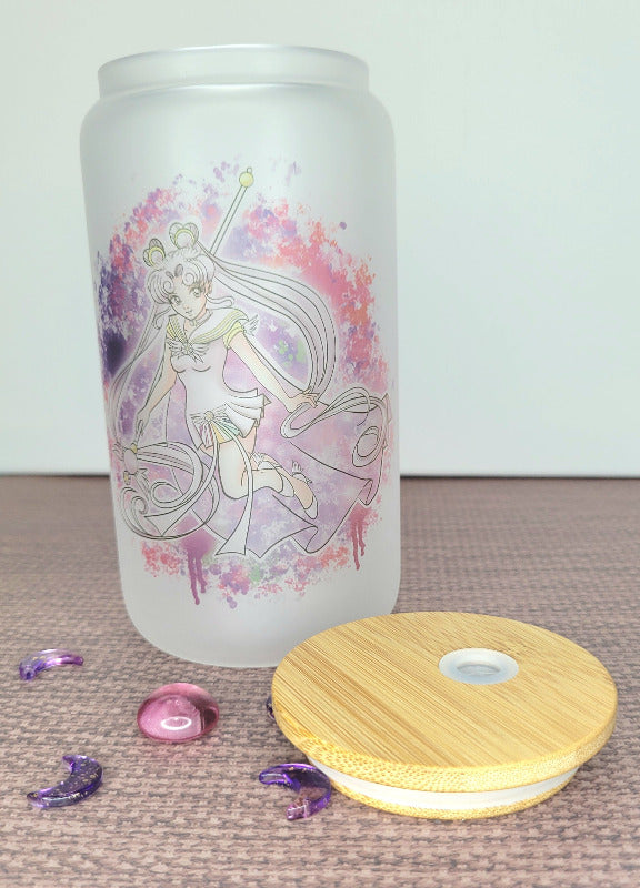 A 20 oz frosted glass cup featuring the iconic Sailor Cosmos. This captivating design showcases Sailor Cosmos in all her celestial beauty, adorned with intricate details and vibrant colors. The frosted glass adds a touch of elegance to the cup, making it a stunning addition to any collection. Embrace the magic of Sailor Cosmos with this enchanting frosted glass cup.