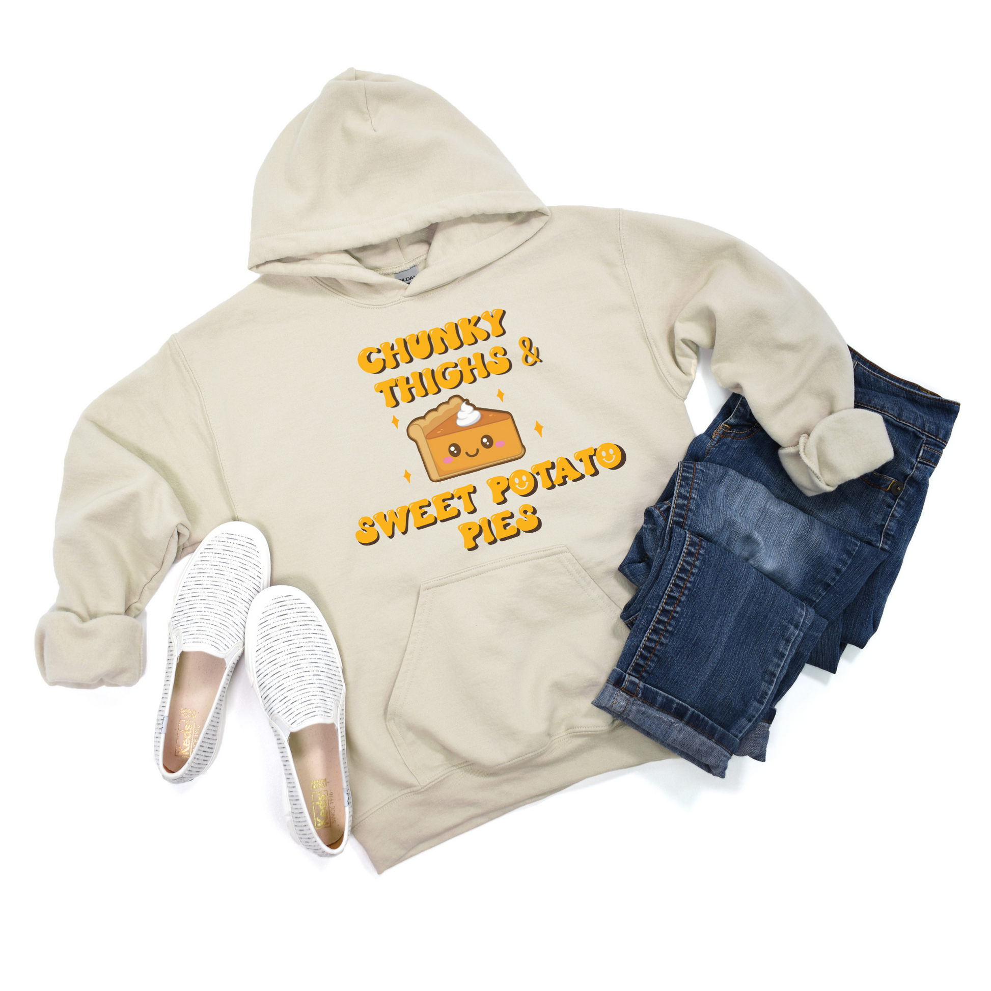 Sand-colored hoodie featuring a playful graphic that reads 'Chunky Thighs and Sweet Potato Pies.' Stay cozy and express your unique style with this fun and comfortable sweatshirt.