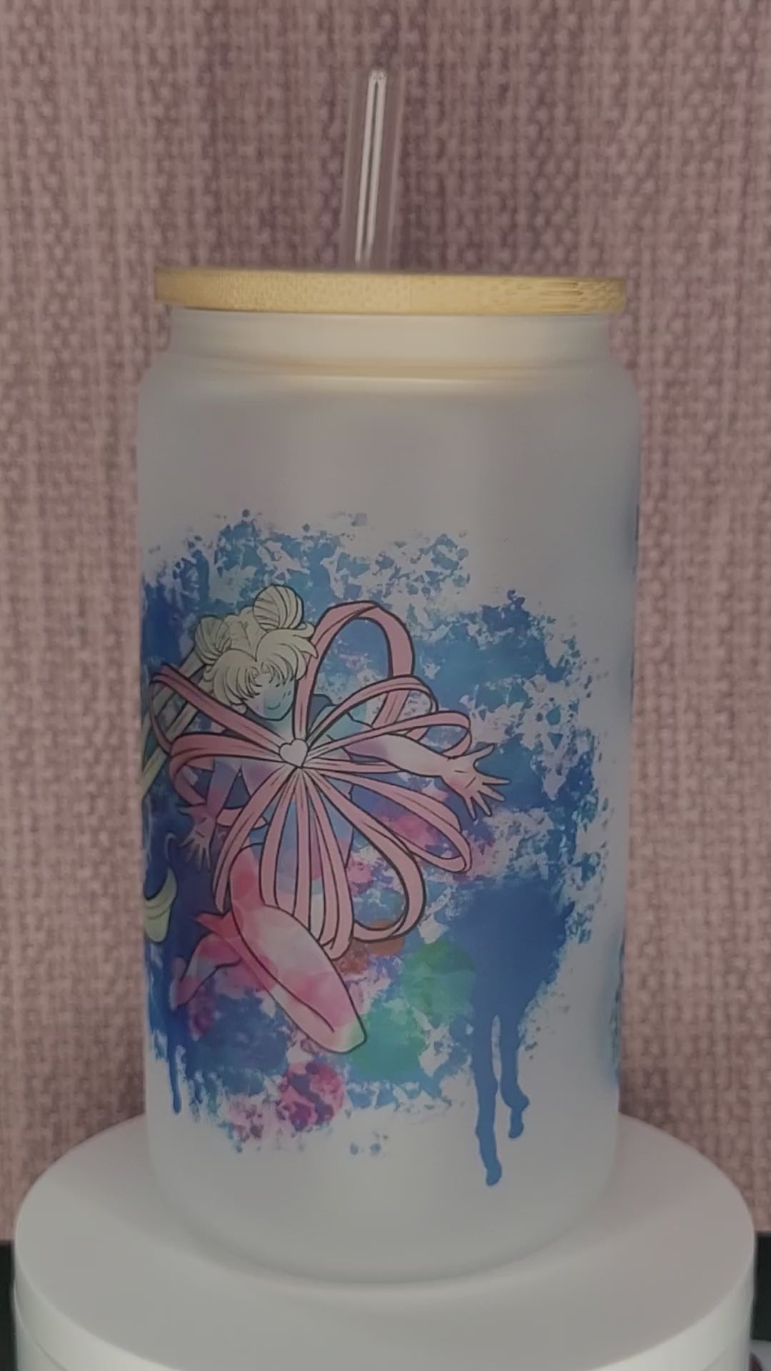 16 oz frosted Sailormoon cup with bamboo lid - a clear cup with a frosted finish featuring Sailormoon character artwork. The cup has a capacity of 16 oz and is topped with a bamboo lid to prevent spills and keep drinks hot or cold.